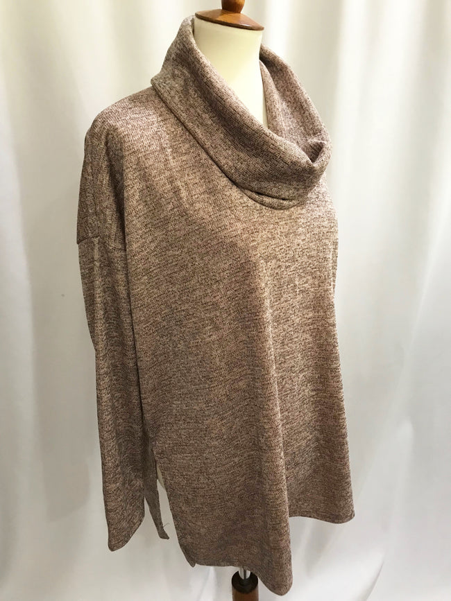 This dark blush color knit top with a hint of sparkle is a great tunic length. It has a cowl neck and side slits with a loose fit. A perfect top to pair with leggings!