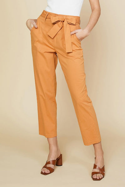 These are the perfect warm weather pants. Featuring a elastic tie waist and light weight fabric. These clay color pants can be styled so many ways - pair with a white tank and denim jacket or a cute floral blouse.  Product Details:  Tie front belt 100% cotton