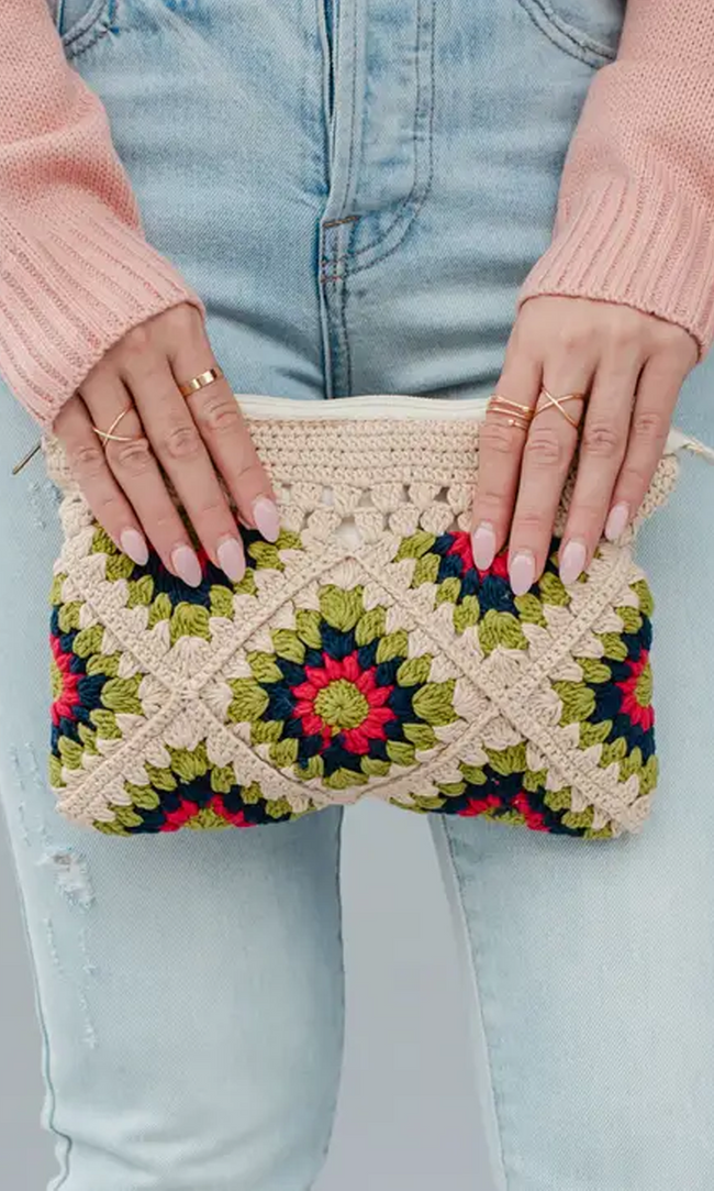 This on trend beige and multicolored crochet clutch is a must have! Featuring a beige lime green, navy and pink color palette. It's the perfect summer accessory!   Product Details:  Zip closure Fully lined Measures 9.5" x 7" x 1" 100% Cotton