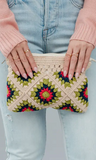 This on trend beige and multicolored crochet clutch is a must have! Featuring a beige lime green, navy and pink color palette. It's the perfect summer accessory!   Product Details:  Zip closure Fully lined Measures 9.5