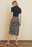 Fresh, fun, floral printed midi skirt. Featuring a silky black satin fabric with an elastic waistband on the back and a hidden back zipper closure.  Product Details:  100% Polyester Model is 5'9