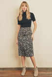 Fresh, fun, floral printed midi skirt. Featuring a silky black satin fabric with an elastic waistband on the back and a hidden back zipper closure.  Product Details:  100% Polyester Model is 5'9
