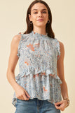 This will be your go to summer top! Lightweight and sleeveless are the perfect combo to keep you cool on warm summer days. The blue floral print will keep you stylish too!   Product Details:  100% Polyester Smock stretch neckline Ruffle high low hem Ruffle trim sleeves Back keyhole closure Semi sheer