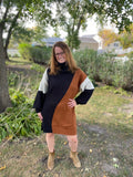 This classic turtleneck style sweater dress will keep you stylish and warm! Featuring black, rust and ivory color block design. Pair with tights and some booties and you'll be ready to go!  Product Details  43% Acrylic, 29% Nylon, 28% Polyester Boxy, straight silhouette Thick sweater knit material Long balloon sleeves Split side hems