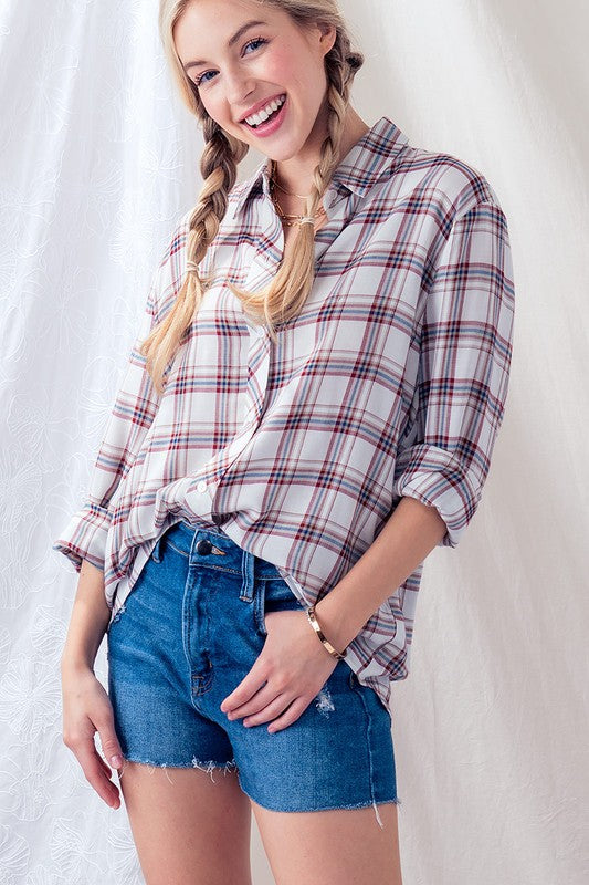 This timeless red and ivory plaid checkered button up shirt is the perfect addition to your Fall wardrobe. Lightweight, long sleeve and perfect for layering. You'll be pretty in plaid as the temps get cooler!