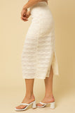 The next sunny day calls for this ivory lace skirt. The intricate lace detail elevates this look and is perfect for a summer event. Lined half way and completed with a sheer lace to hem. Pair with matching top or add a pop of color, so many styling options.  Product Details:  95% Polyester, 5% Spandex Lining 100% Polyester Half lined Zip closure Midi length Back slit