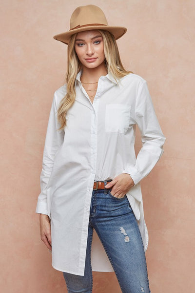 We love the ease of this white button down tunic shirt. Simple, classic style that works great with leggings or jeans.   Product Details:  100% Cotton  Length 37", sleeve length 24" Poplin weave Long sleeve, collar
