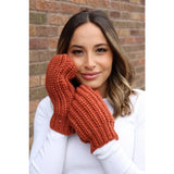 These terracotta , fleece lined knit mittens will be a great addition to your winter accessories. You can never have to many gloves!These terracotta, fleece lined knit mittens will be a great addition to your winter wardrobe. The attractive mitten features a large braided cable knit pattern in a stunning orange color.   Product Details:  100% Acrylic, Lining 100% Polyester One size fits most Fleece lined interior