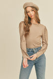 Easy and comfy like a good cup of coffee! This long sleeve top with ruffle detailing and classic toffee color that screams fall! Use as a layering piece or wear along with your favorite pair of jeans!  Product Details:   Long sleeve top with ruffle detail Round neck Ruffle detail down the sleeves Semi-fitted lightweight top Shorter length Model is 5' 9