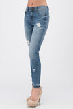 Sneak Peek distressed mid rise skinny jean with a fun released hem. Just the right amount of distress and stretch.