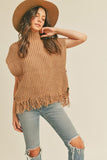 This sleeveless taupe fringe poncho vest has a slight boho vibe. Featuring a mock neck and open at the sides with button closure. Pair with a long sleeve top as the temperatures dip and your favorite pair of jeans.   Product Details:  Fabric is 100% Acrylic Ribbed high neckline Fringe hem Side button closure Boxy silhouette Model is 5' 9