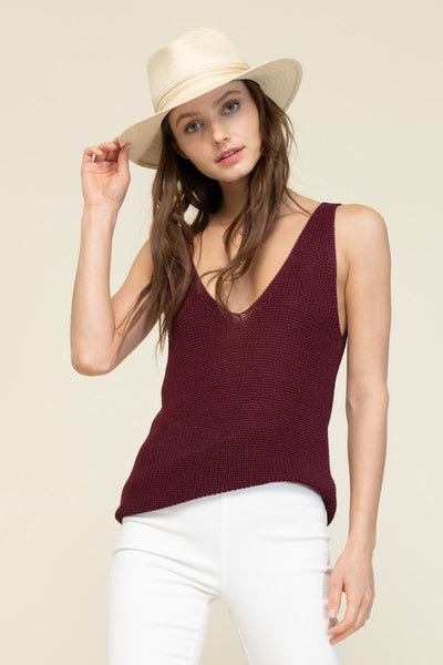 This easy sweater tank is a perfect transition piece. Featuring a stunning wine color and v neck style. A timeless piece that can be worn under a blazer and tucked into your favorite pair of jeans.   Product Details:  89% Viscose, 11% Nylon Sweater texture Sleeveless tank