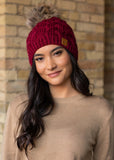 This stunning wine color cable knit fleece lined hat with keep your head warm and stylish!  Product Details:  100% Acrylic, Lining 100% Polyester Knit hat Comfy fleece lining Faux fur pom accent