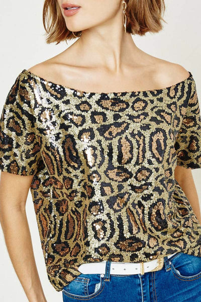 WOW - that's what you'll hear wearing this stunning top. The leopard print sequin is fabulous plus the off the shoulder neckline is a perfect fit. This top looks great with a skirt or with a pair of your favorite jeans. It will add a bit of fun and sparkle to your outfit.